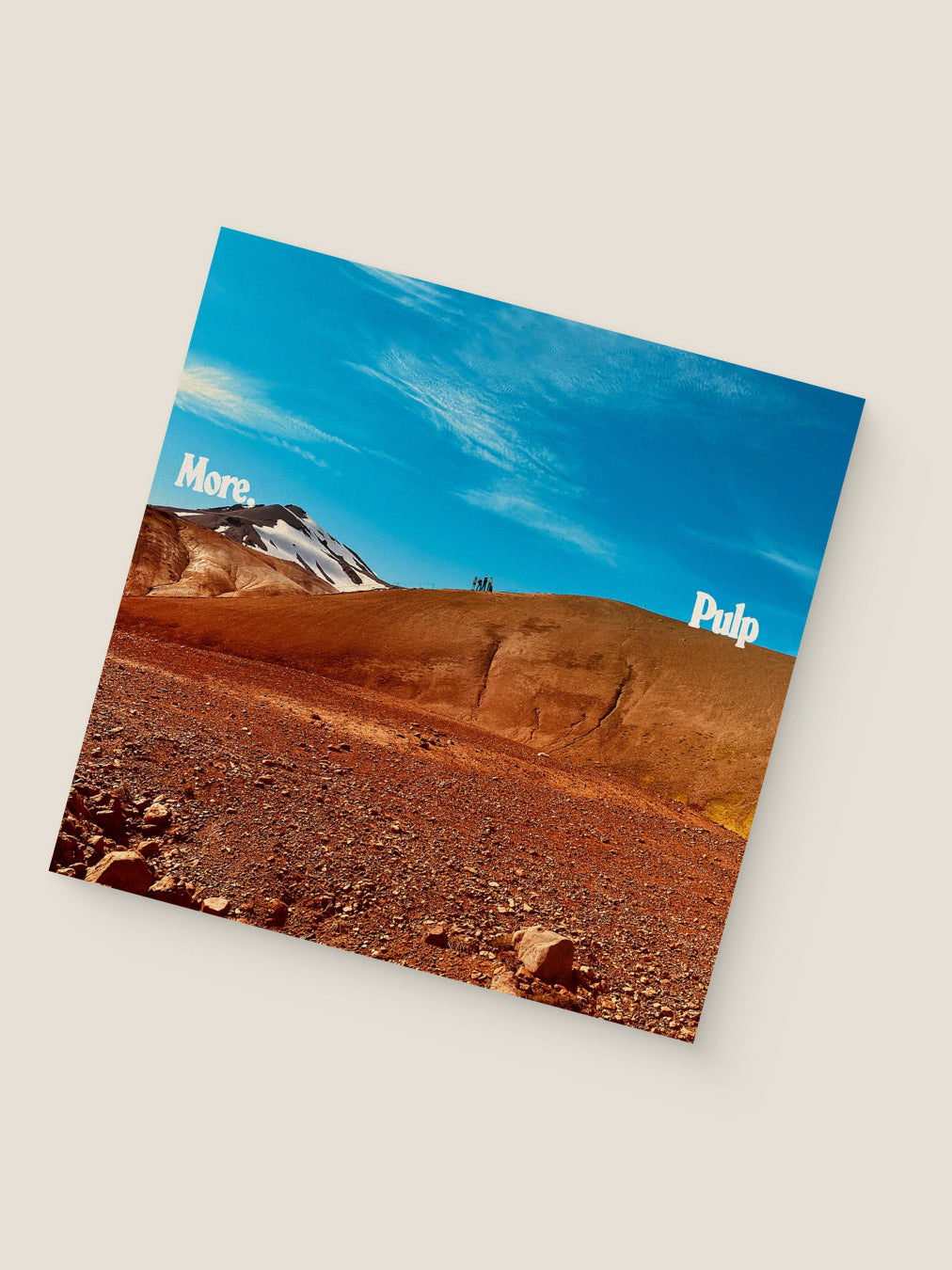 Album cover with a desert landscape and blue sky, featuring the text 'More Pulp'.