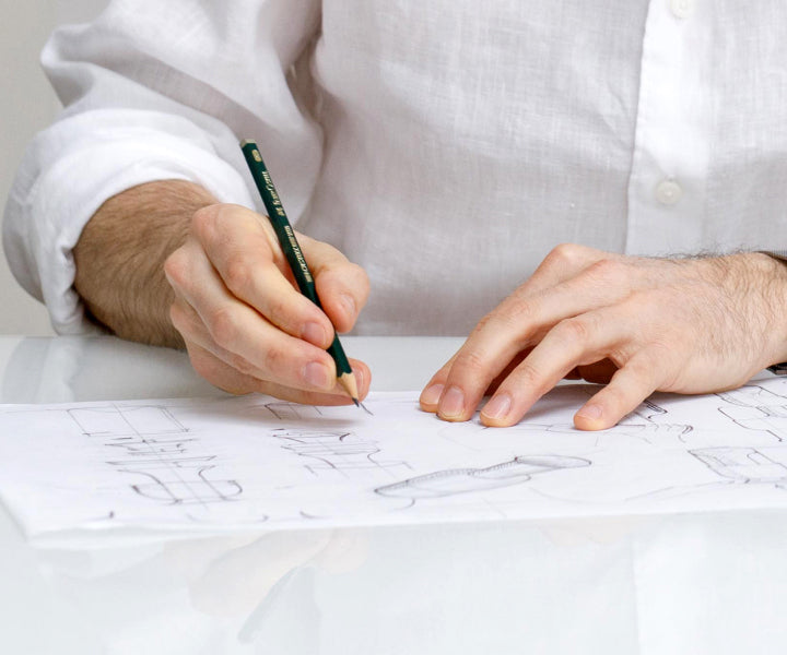eto inventor Tom Cotton sketching designs for the eto wine decanter